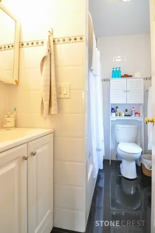 a bathroom with a toilet and a sink