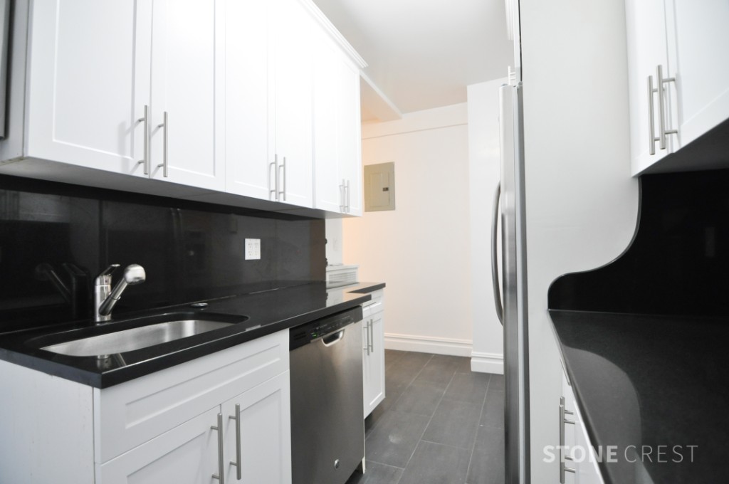 290 Riverside Drive, Unit 2B Manhattan, NY 10025 - Photo 6 of 17 a kitchen with a sink and a refrigerator