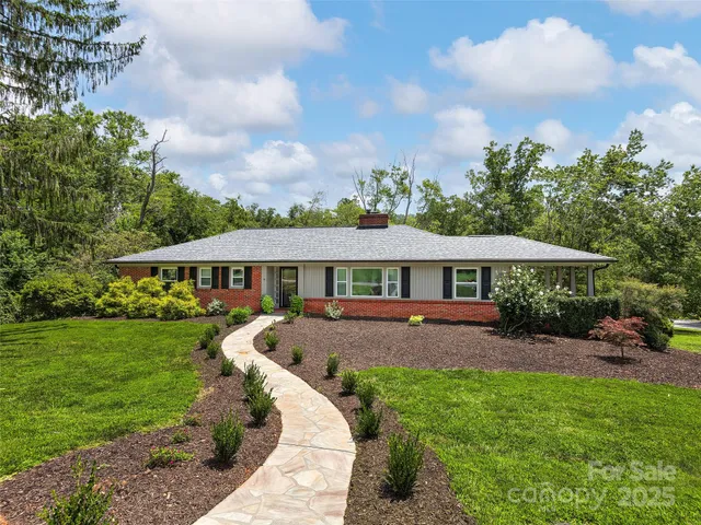 a view of a house with a garden