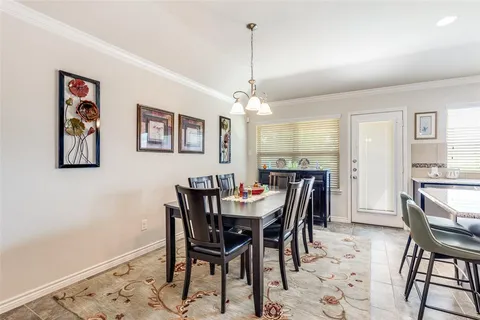 a view of a dining room with furniture and window