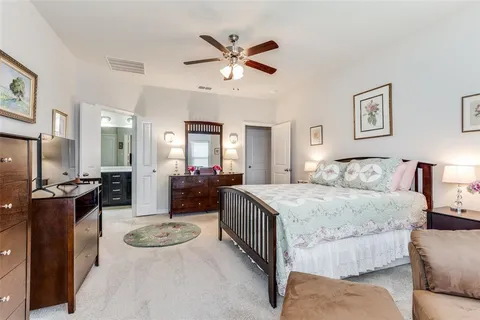 a bed room with a bed and furniture