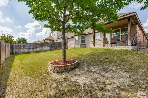 a swimming pool with trees in the background