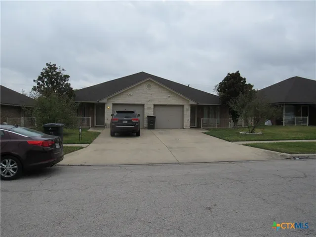 a view of street with parked cars