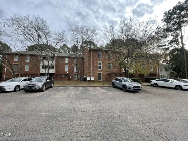 a view of street with parked cars