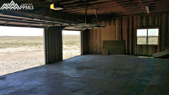 27055 Handle Road Calhan, CO 80808 - Photo 25 of 25 Looking out the garage doors onto the property.