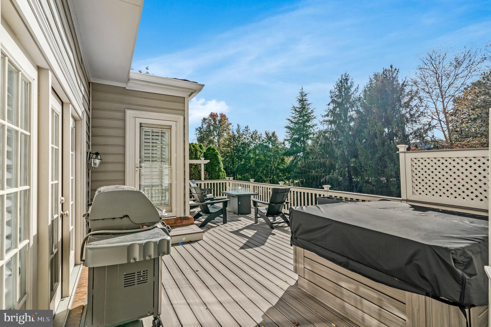 9733 Hidden Valley Road Vienna, VA 22181 - Photo 5 of 11 a view of balcony with wooden floor and outdoor seating