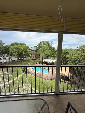 a view of balcony with furniture