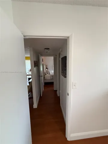 a view of a hallway with a furniture