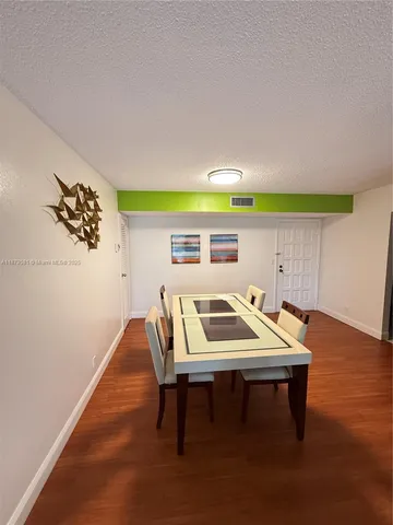 a room with furniture and wooden floor