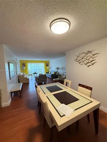 a kitchen with a table and chairs