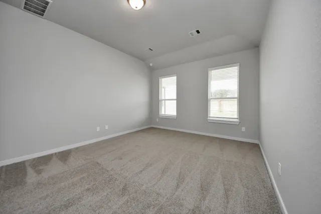 a spacious bathroom with a shower sink double vanity granite tub shower and mirror