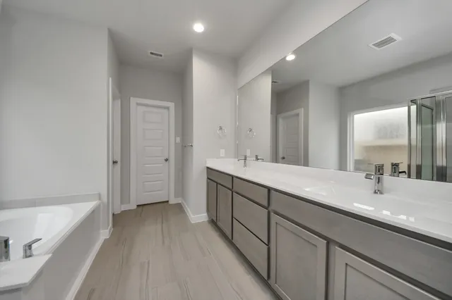 a living room with furniture a flat screen tv and a large window