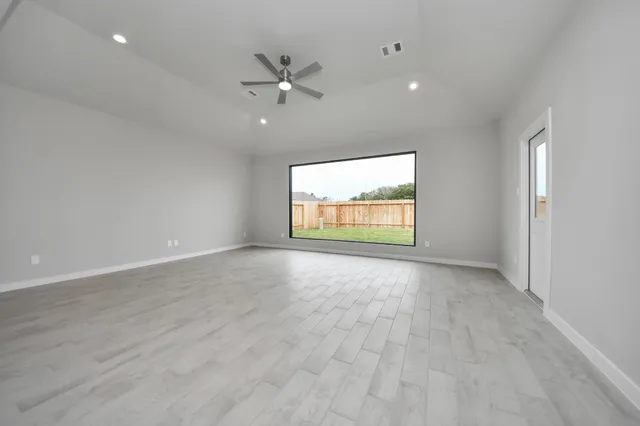 an empty room with closet area