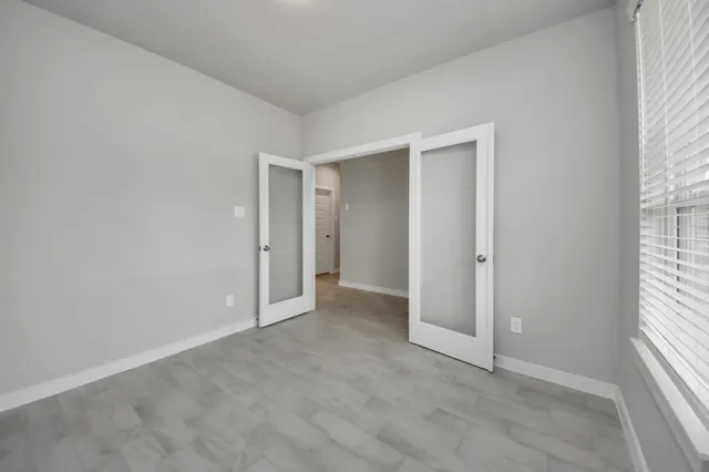 a view of a dining room with furniture and window