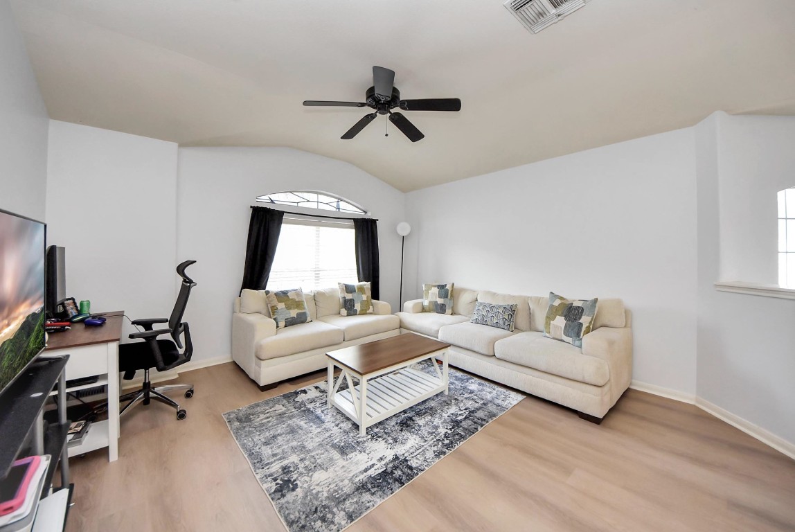 1054 Inverness Cove Dickinson, TX 77539 - Photo 15 of 28 a living room with furniture and a window