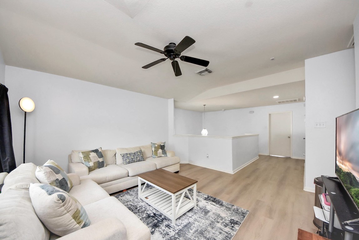 1054 Inverness Cove Dickinson, TX 77539 - Photo 16 of 28 a living room with furniture and a flat screen tv