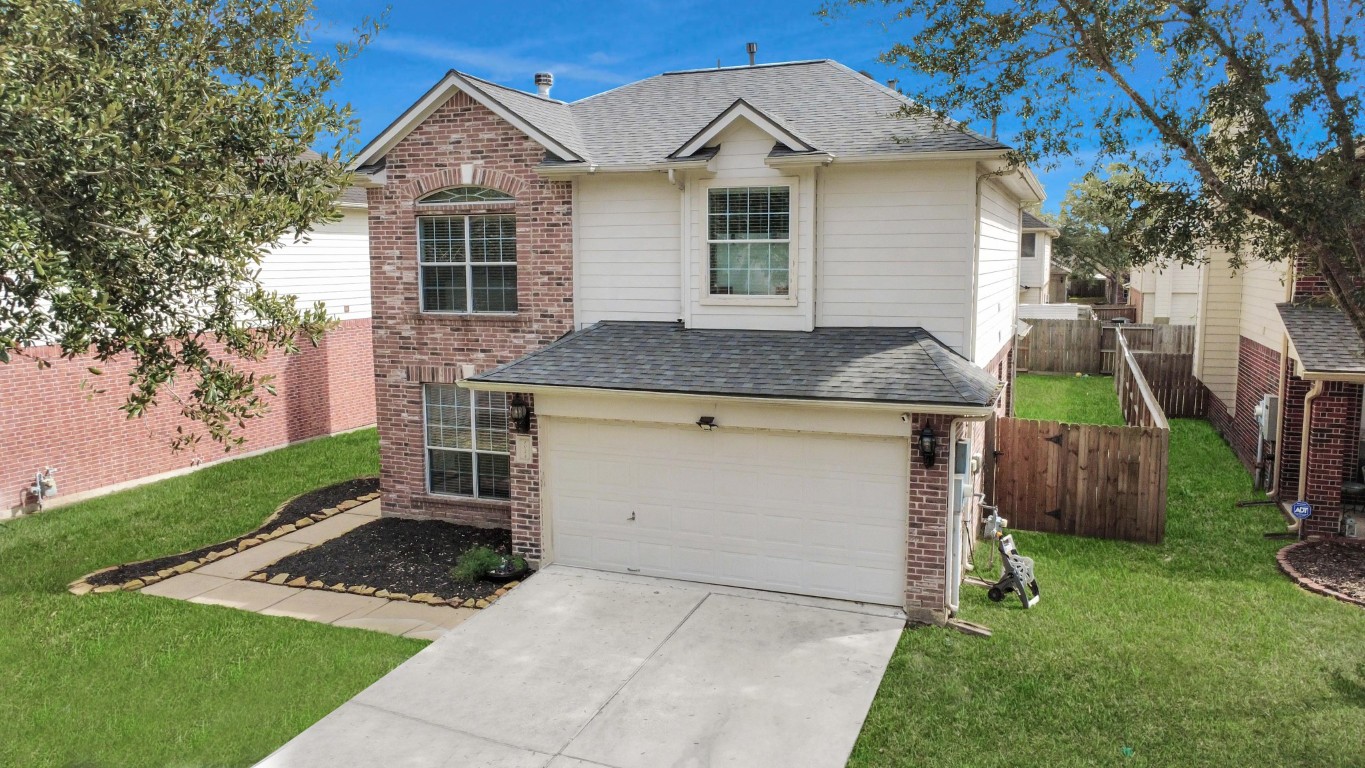 1054 Inverness Cove Dickinson, TX 77539 - Photo 2 of 28 a view of a house with a yard