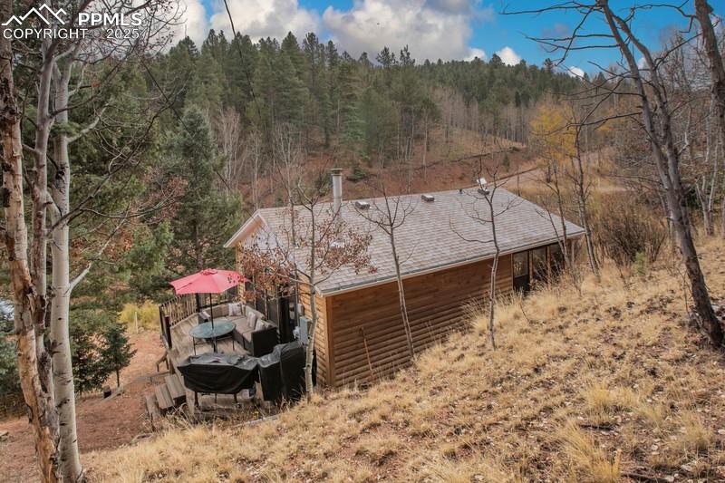 361 Willow Road Divide, CO 80814 - Photo 5 of 27 a view of a terrace with a bench in the backyard