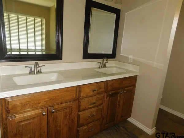 a bathroom with a shower and a sink