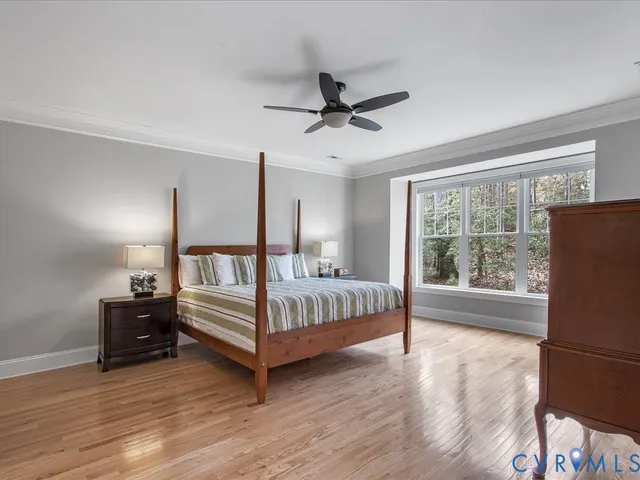 a view of staircase with wooden floor and white walls