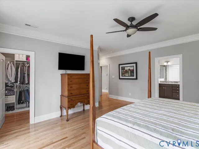 a bathroom with a sink double vanity granite tub and a mirror