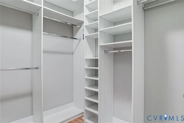 a view of a livingroom with a ceiling fan and window