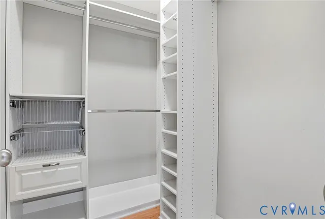 an aerial view of residential houses with outdoor space and parking