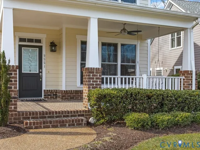 a view of a house with a door and wooden floor