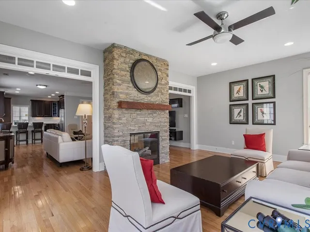 a kitchen with stainless steel appliances granite countertop a sink and dishwasher a refrigerator with wooden cabinets