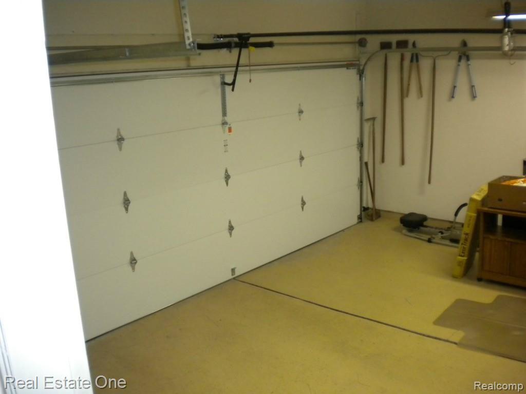 36615 Valley Ridge Drive Farmington, MI 48331 - Photo 47 of 51 Finished garage, elec door openers, plenty of room for cars plus lots of stuff!
