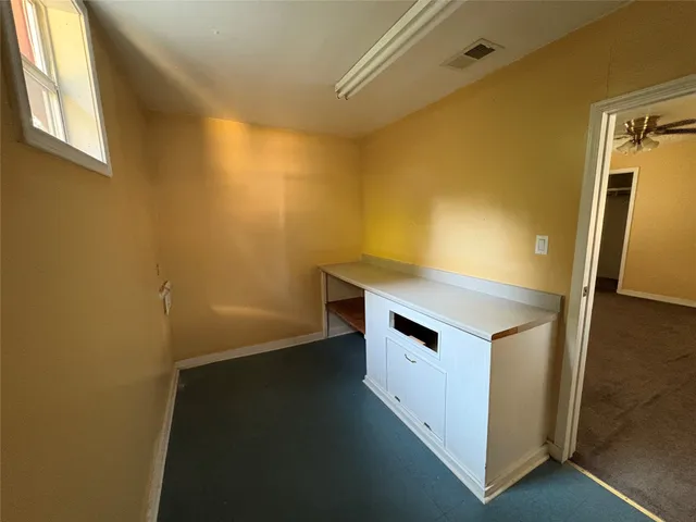 a view of walk in closet with window