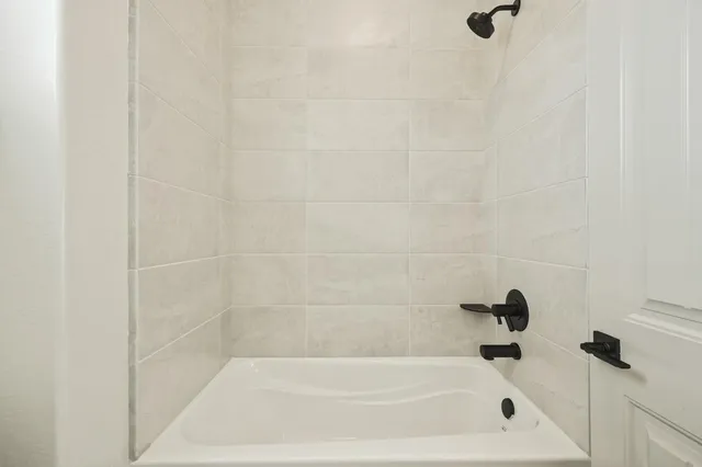a bathroom with a sink mirror and toilet
