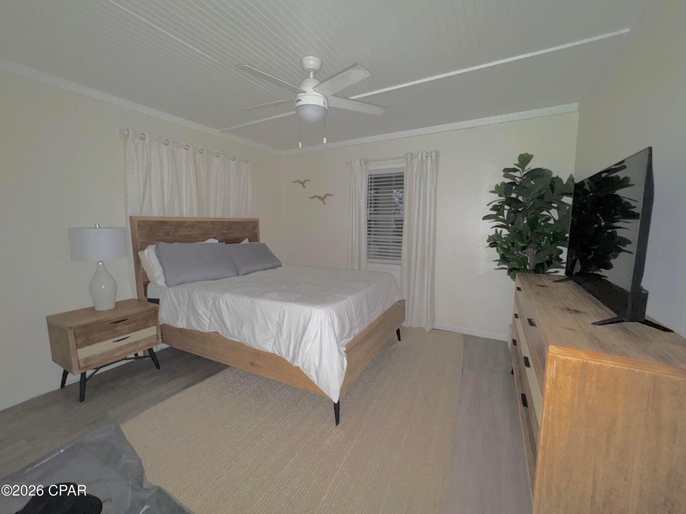 181 Gulf Point Road Santa Rosa Beach, FL 32459 - Photo 13 of 18 a bedroom with a bed and a couch