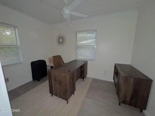 a view of workspace with furniture and window