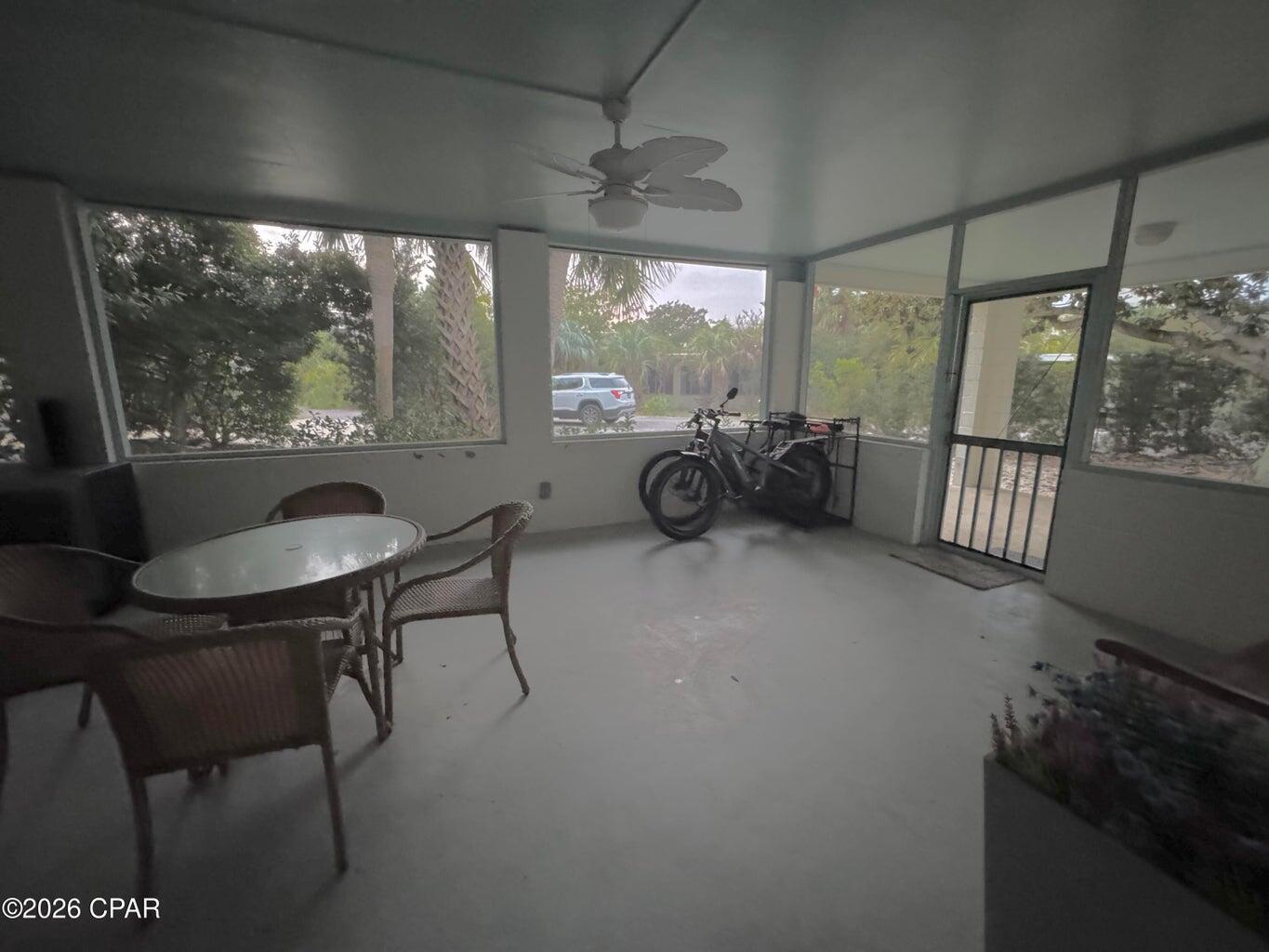 181 Gulf Point Road Santa Rosa Beach, FL 32459 - Photo 15 of 18 a view of a porch with furniture and a yard