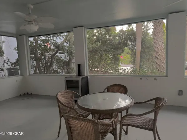 a view of a dining room with furniture window and outside view