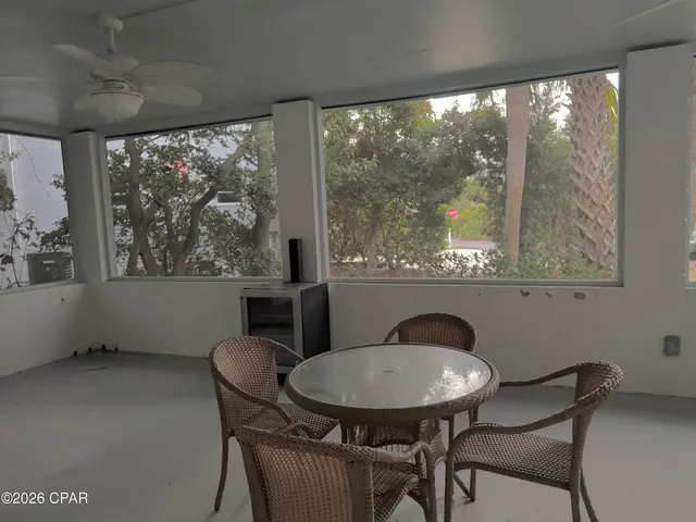 a view of a dining room with furniture window and outside view