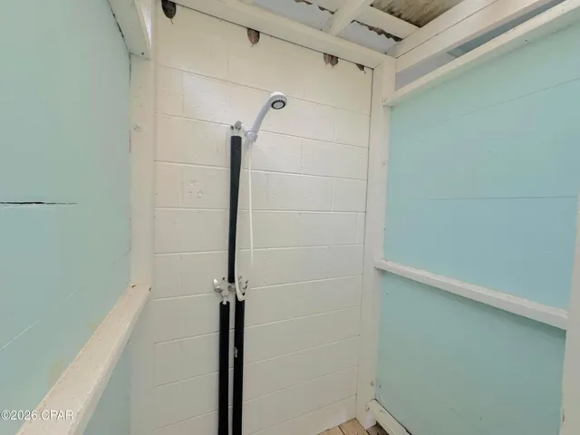 a bathroom with a glass door shower