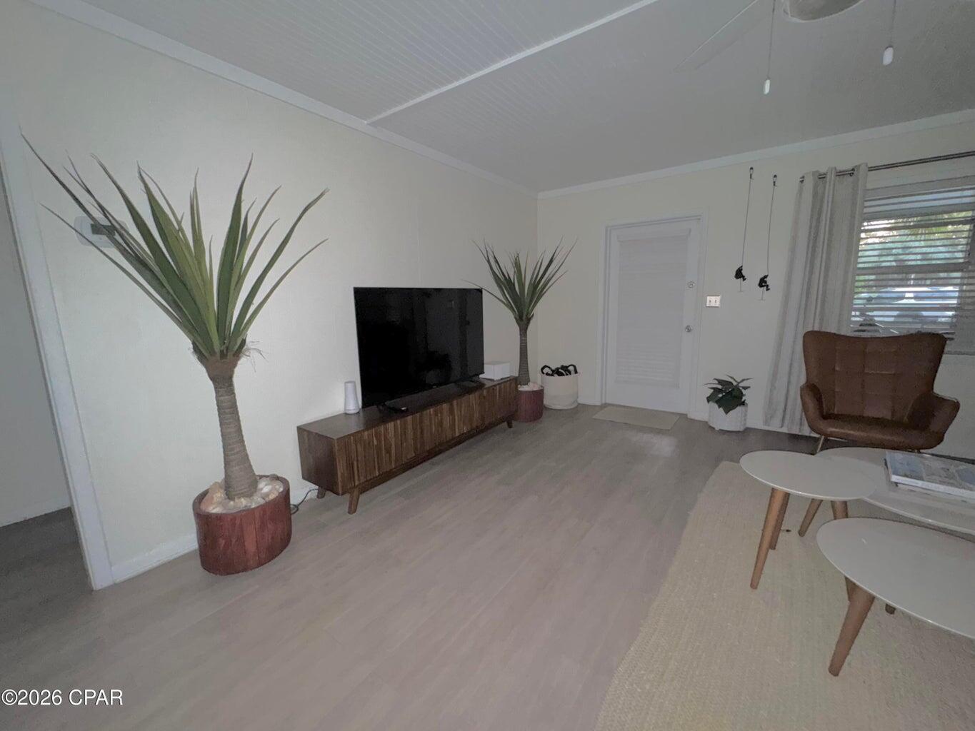 181 Gulf Point Road Santa Rosa Beach, FL 32459 - Photo 5 of 18 a living room with furniture and a flat screen tv
