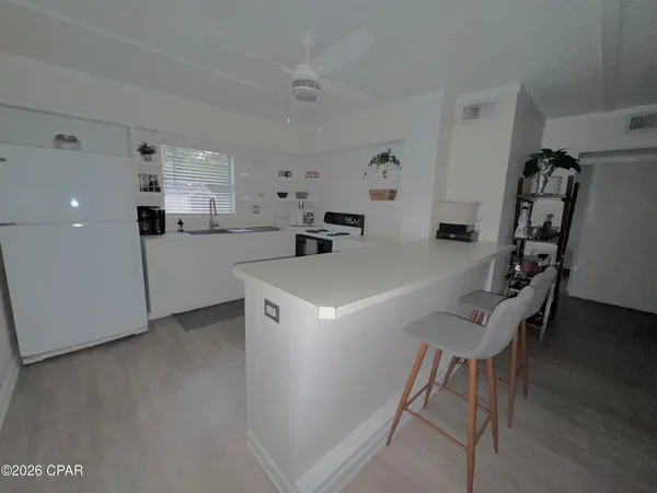a kitchen with furniture and a table