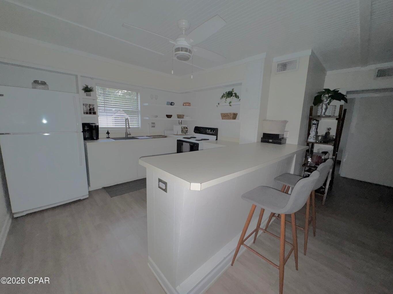 181 Gulf Point Road Santa Rosa Beach, FL 32459 - Photo 10 of 18 a kitchen with furniture and a table