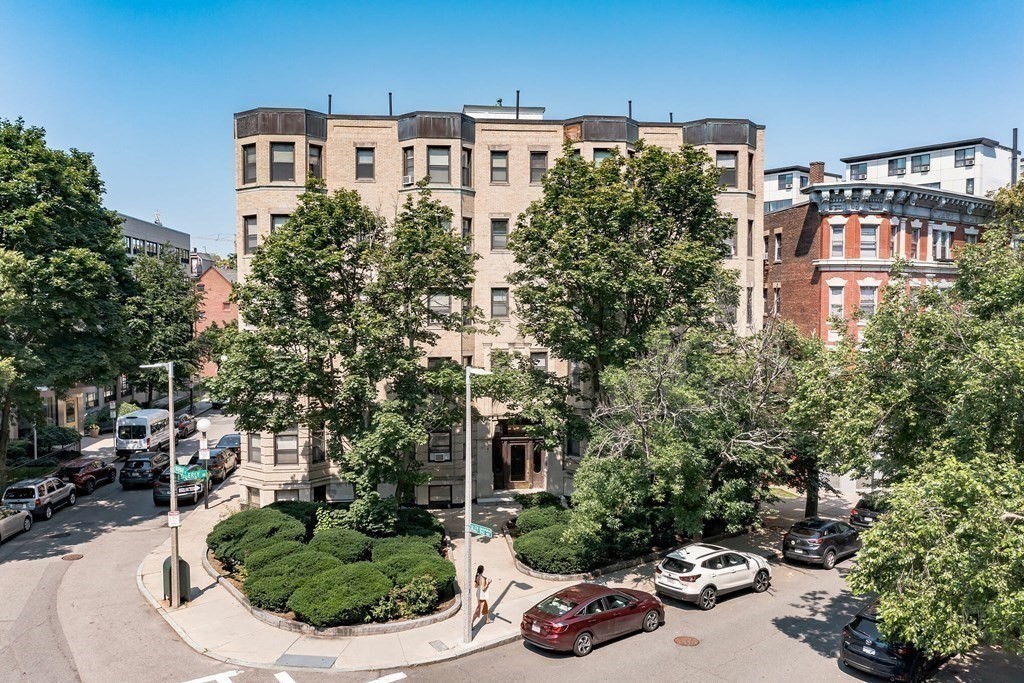 41 Edgerly Road, Unit 28 Boston, MA 02115 - Photo 13 of 13 a aerial view of a house with a yard and potted plants