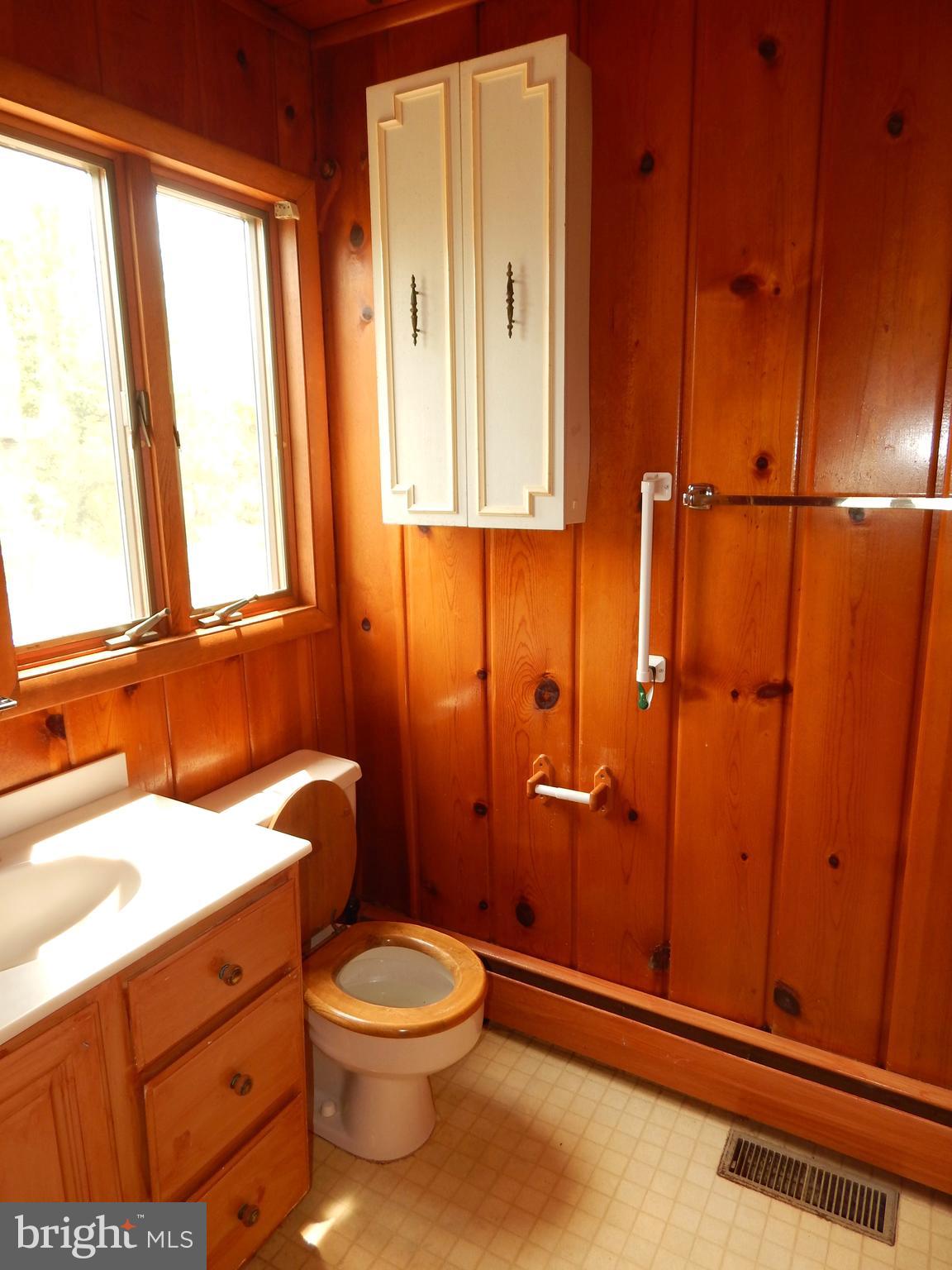 4020 Dahlia Road Port Republic, MD 20676 - Photo 10 of 23 a bathroom with a granite countertop sink toilet and shower