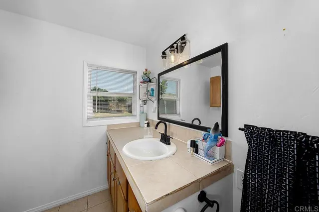 a bathroom with a sink and a mirror