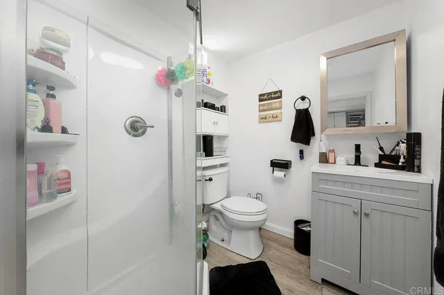 a bathroom with a sink toilet and shower