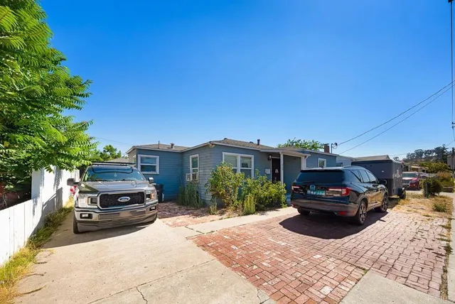 a car parked in front of a house