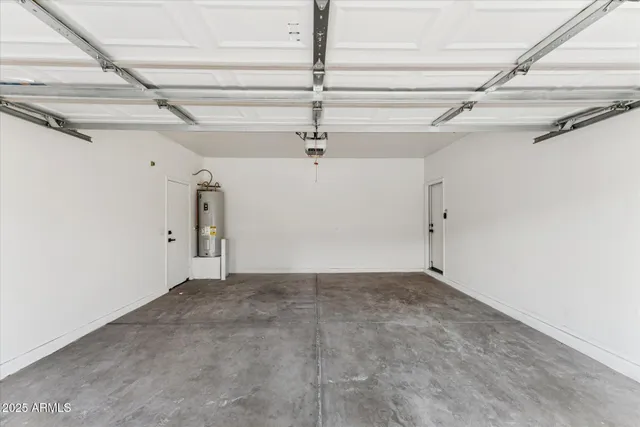 a view of a room with a ceiling fan