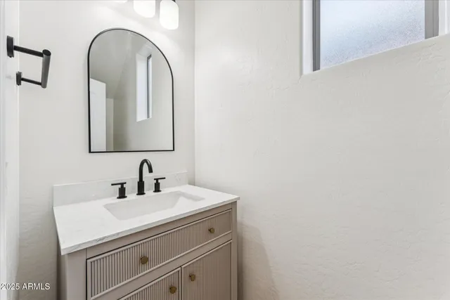 a close up of a mirror and sink