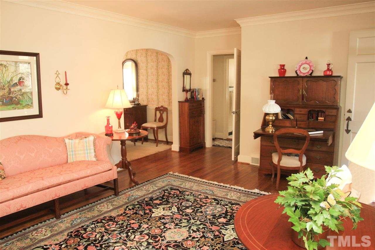 3117 Georgian Terrace Raleigh, NC 27607 - Photo 11 of 25 a living room with furniture and a wooden floor