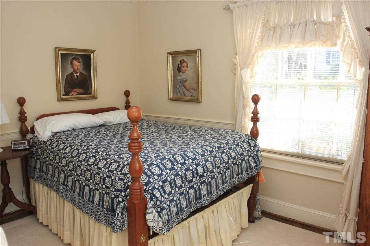 3117 Georgian Terrace Raleigh, NC 27607 - Photo 15 of 25 a bedroom with bed and wooden floor